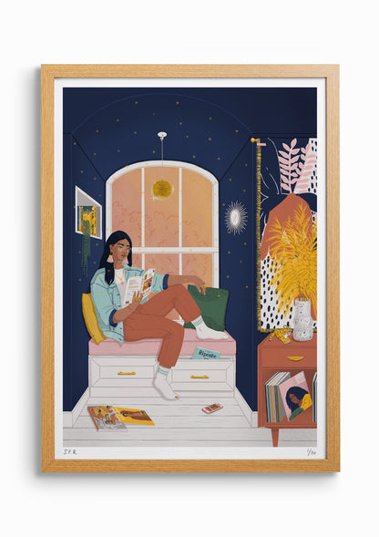 Framed illustration of a South Asian woman reading the book How to Be Both by Ali Smith. She is sat by the window in a nook and she is surrounded by books, magazines, and vinyls.