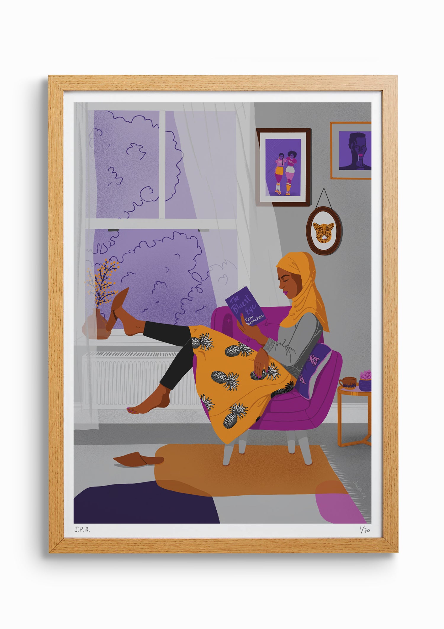 Framed illustration of a Muslim woman reading the book The Bluest Eye by Toni Morrison. She is sat by the window on an armchair and the light curtains are being moved by the breeze.